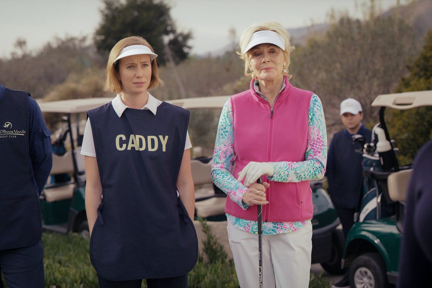 Ava and Deborah standing on a golf course.