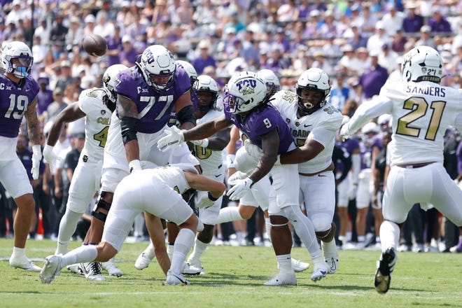 TCU running back Emani Bailey (9) fumbles the ball in the first quarter against Colorado at Amon G. Carter Stadium.