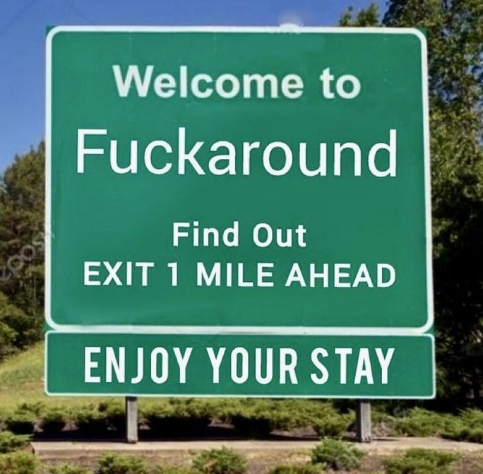 Photoshopped highway sign reading 'Welcome to Fuckaround. Find Out Exit 1 mile ahead'