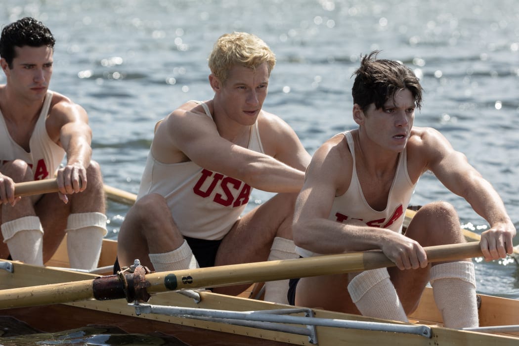 (l-r.) Bruce Herbelin-Earle stars as Shorty Hunt, Callum Turner as Joe Rantz and Jack Mulhern as Don Hume in director George Clooney’s THE BOYS IN THE BOAT. An Amazon MGM Studios film. Photo credit: Laurie Sparham. © 2023 Metro-Goldwyn-Mayer Pictures Inc. All Rights Reserved.