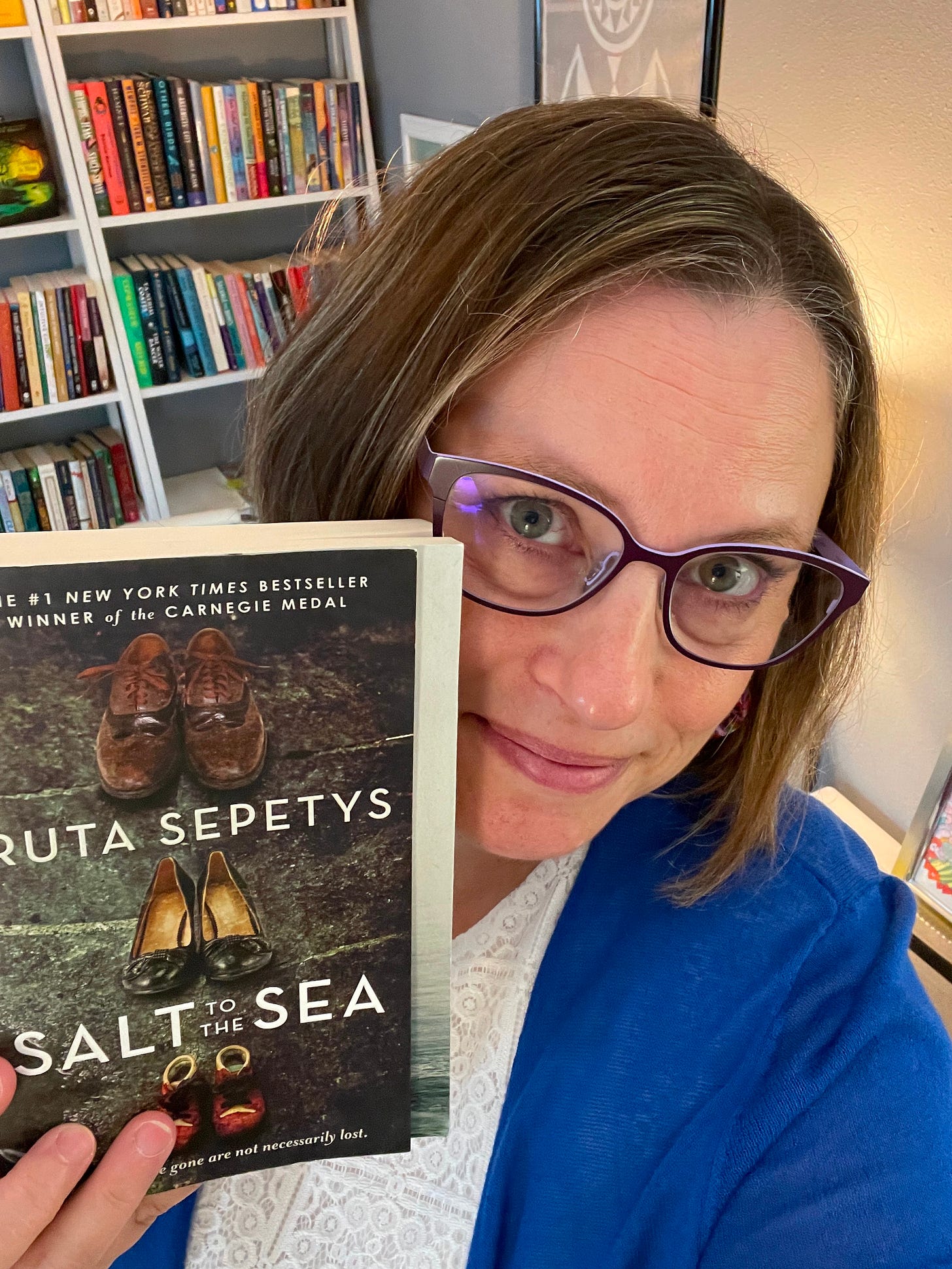 Stephanie holding a copy of the book