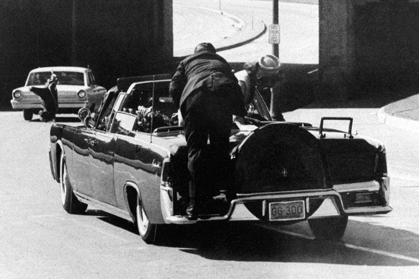 The presidential limousine on Elm Street moments after the shooting