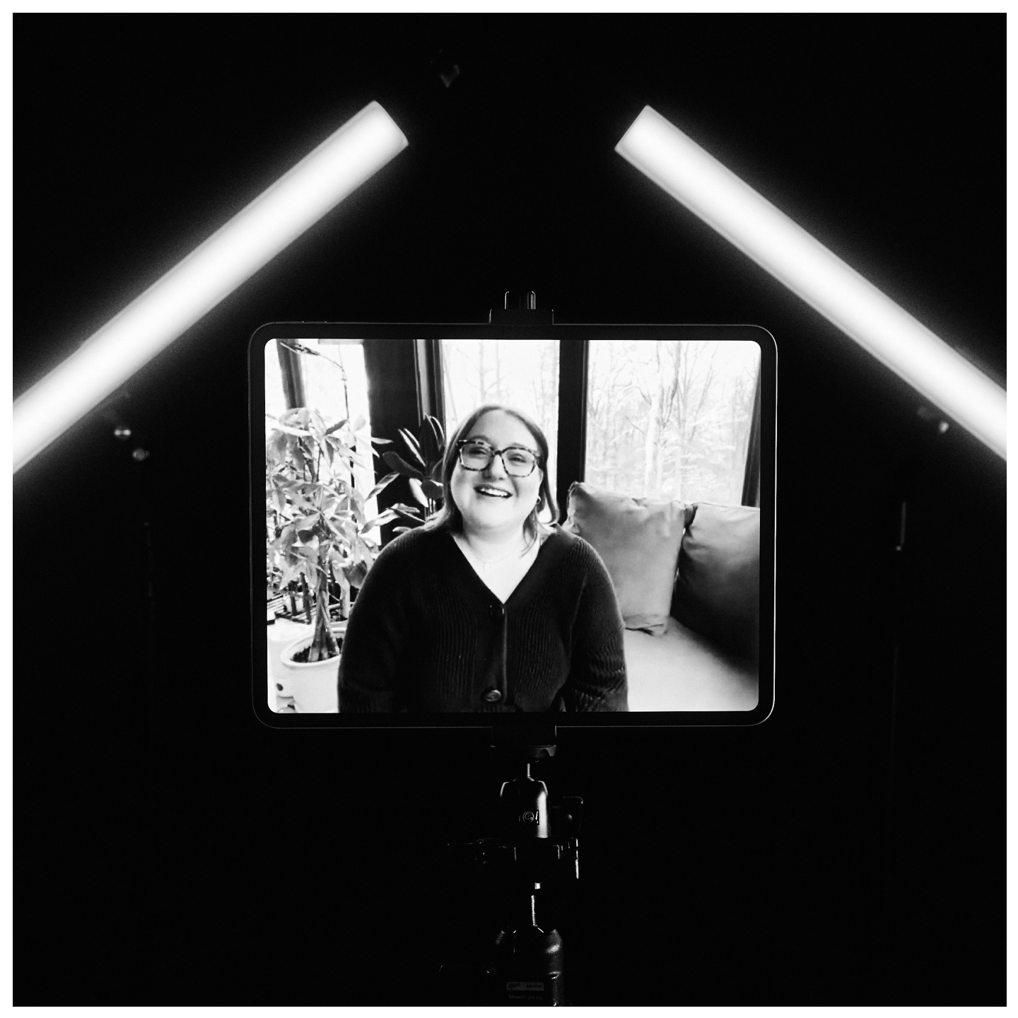 Black and white photo of Meridian Culpepper on a tablet screen, positioned between two studio lights, symbolizing her remote presence and transition from LA to a new chapter in the Midwest, by LA portrait photographer Afonso Salcedo.