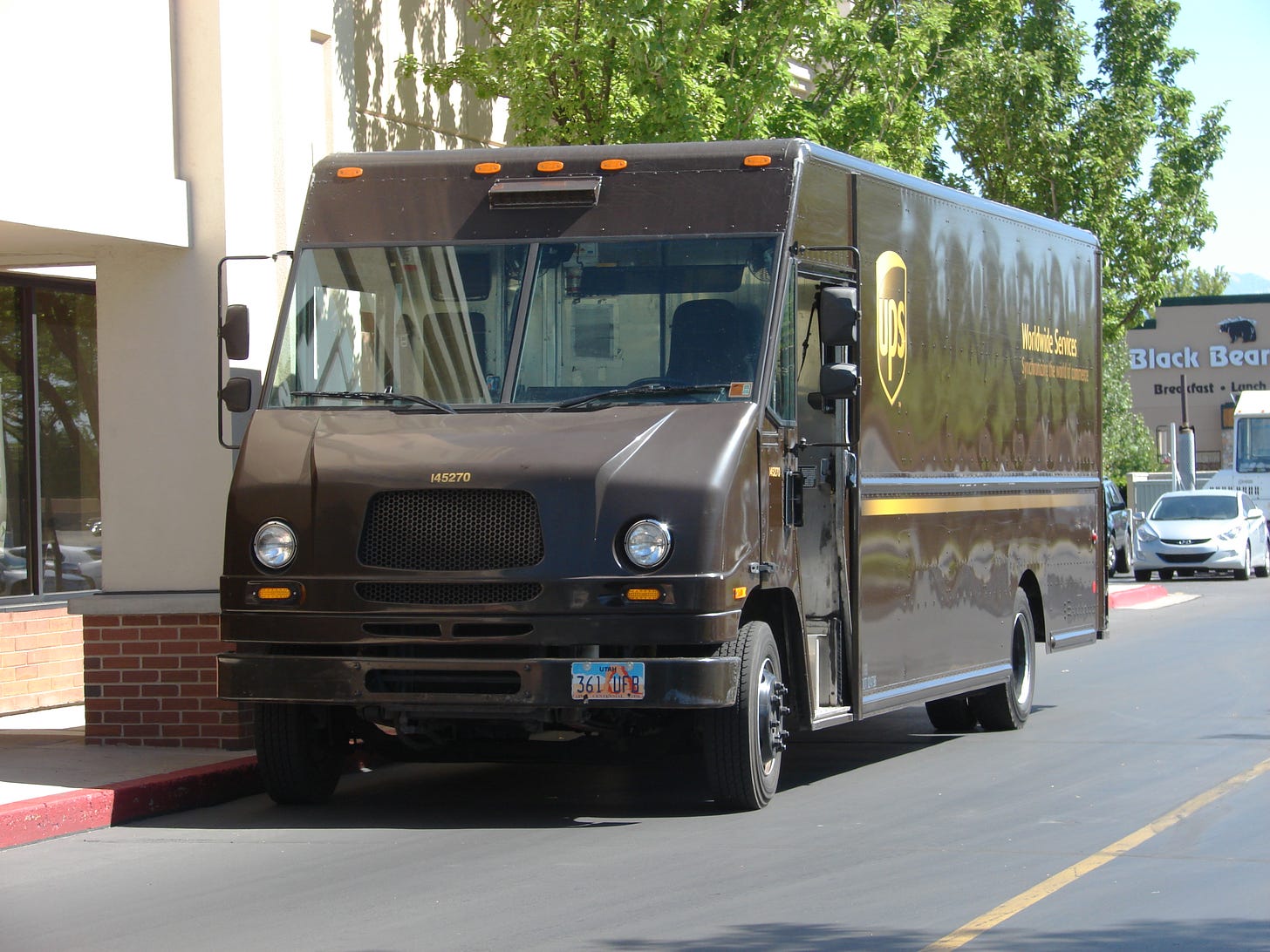 A UPS truck on a sunny street