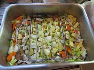 Lining the Pan with your root vegetable gravy thickener...mmmm. GOLD!