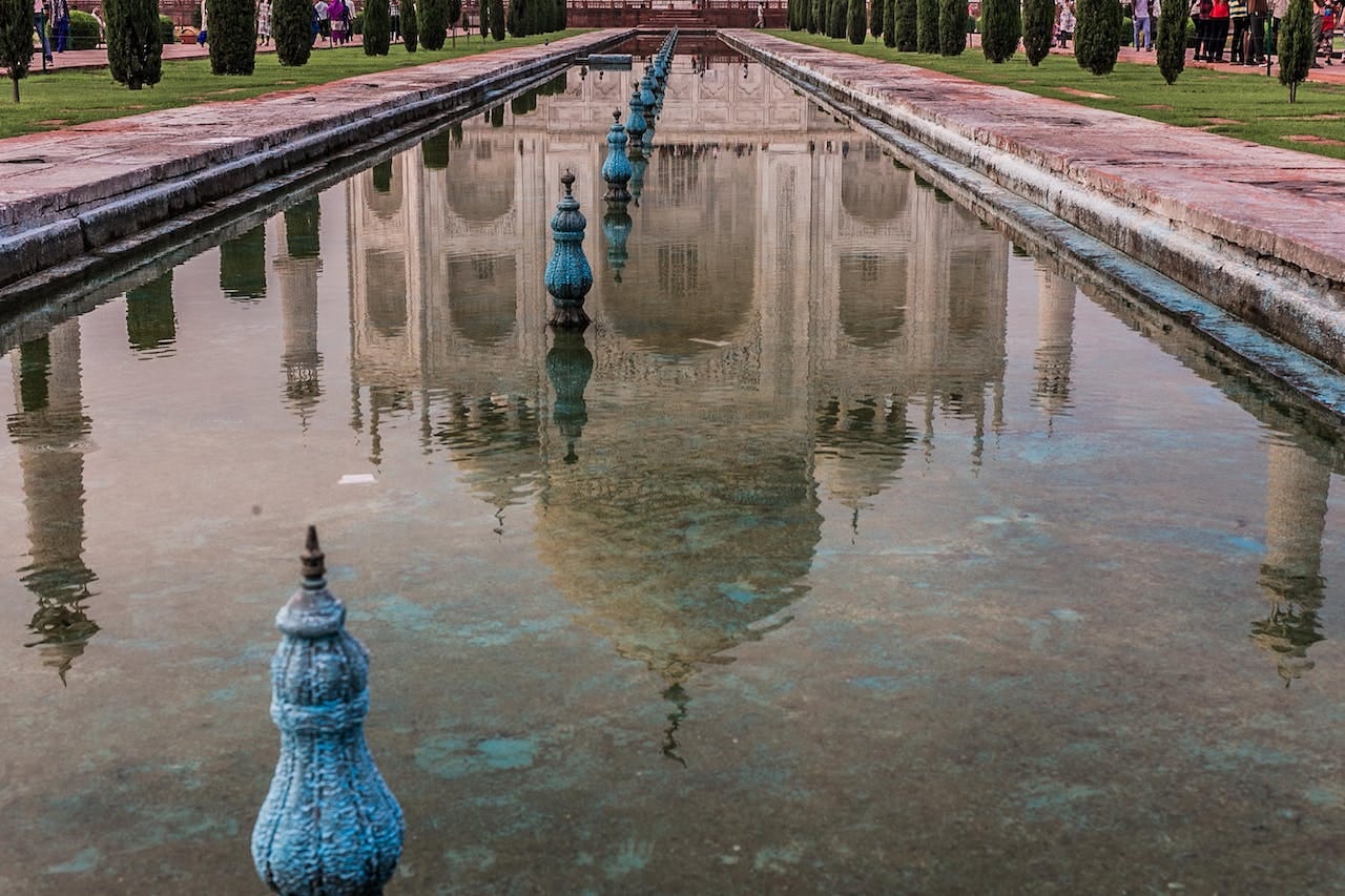 The Taj Mahal, reflected in the water.
