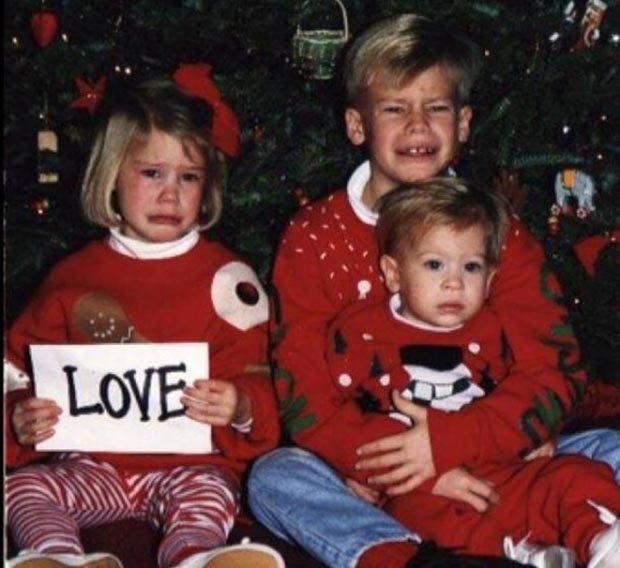 Feel the love! ~ Funny Family Christmas Photos ~ crying kids holding love sign