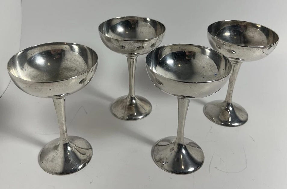 Four silverplated coupes.