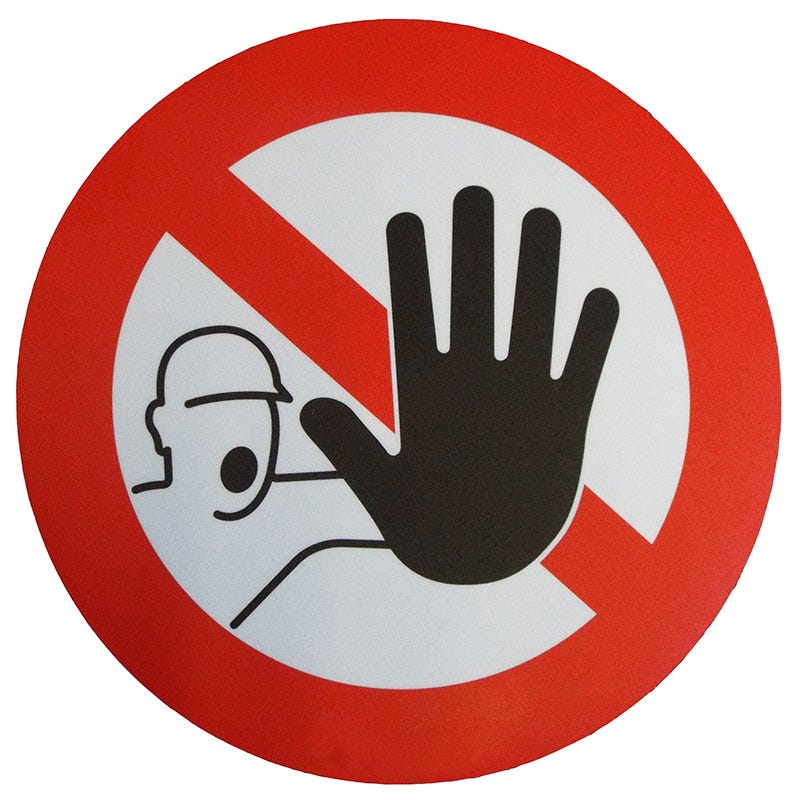 Stop sign with a man and hand.