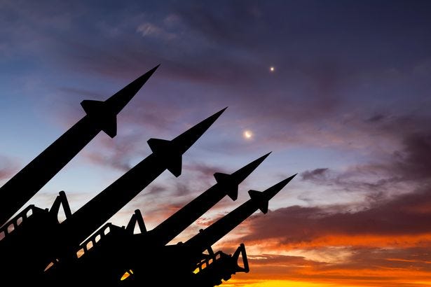 Nuclear missiles lined up at sunset