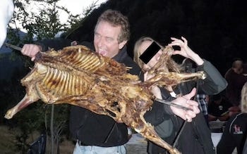 Mr Kennedy with an animal carcass