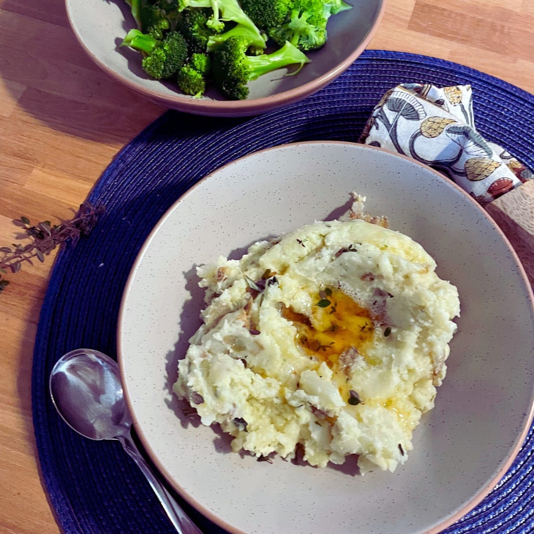 Brown Butter Boursin Mashed Potatoes on a white plate