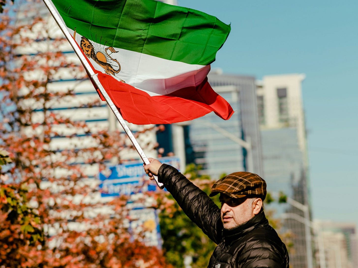 a man holding a flag a man holding a flag
