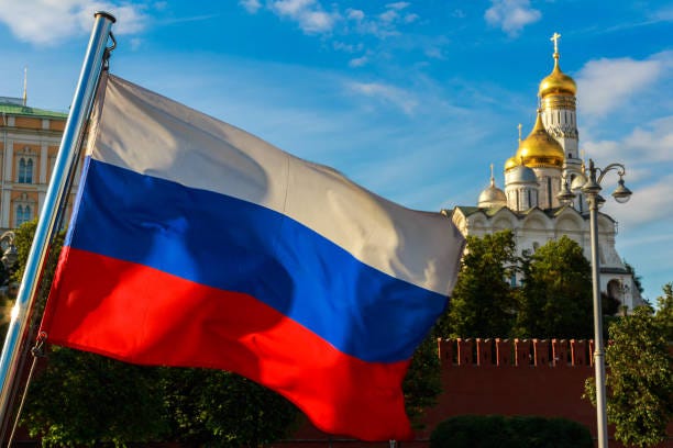 Russian Flag On The Background Of The Kremlin Archangel Cathedral In The  Moscow Kremlin Stock Photo - Download Image Now - iStock