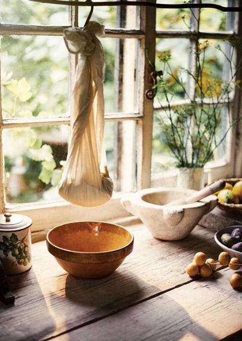 a cheesecloth suspended over a mixing bowl