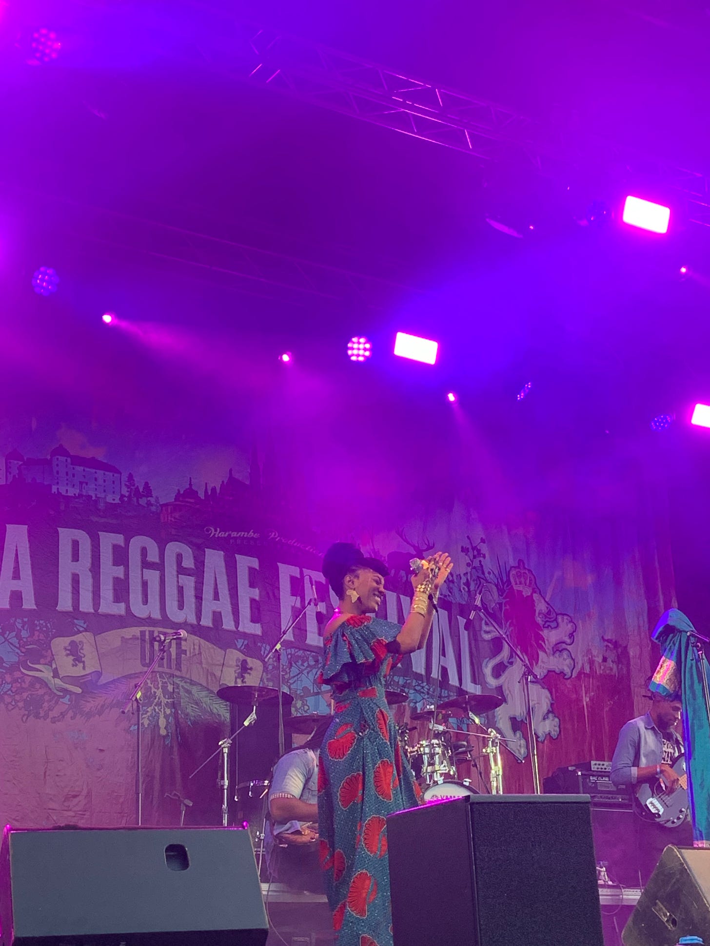 hempress sativa, a black reggae arists claps on stage following an amazing performance