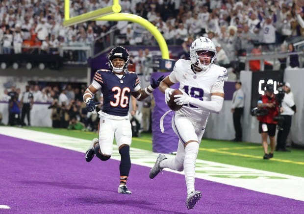 Vikings wide receiver Justin Jefferson runs through the end zone...