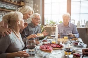 Senior friends having dinner for Christmas evening
