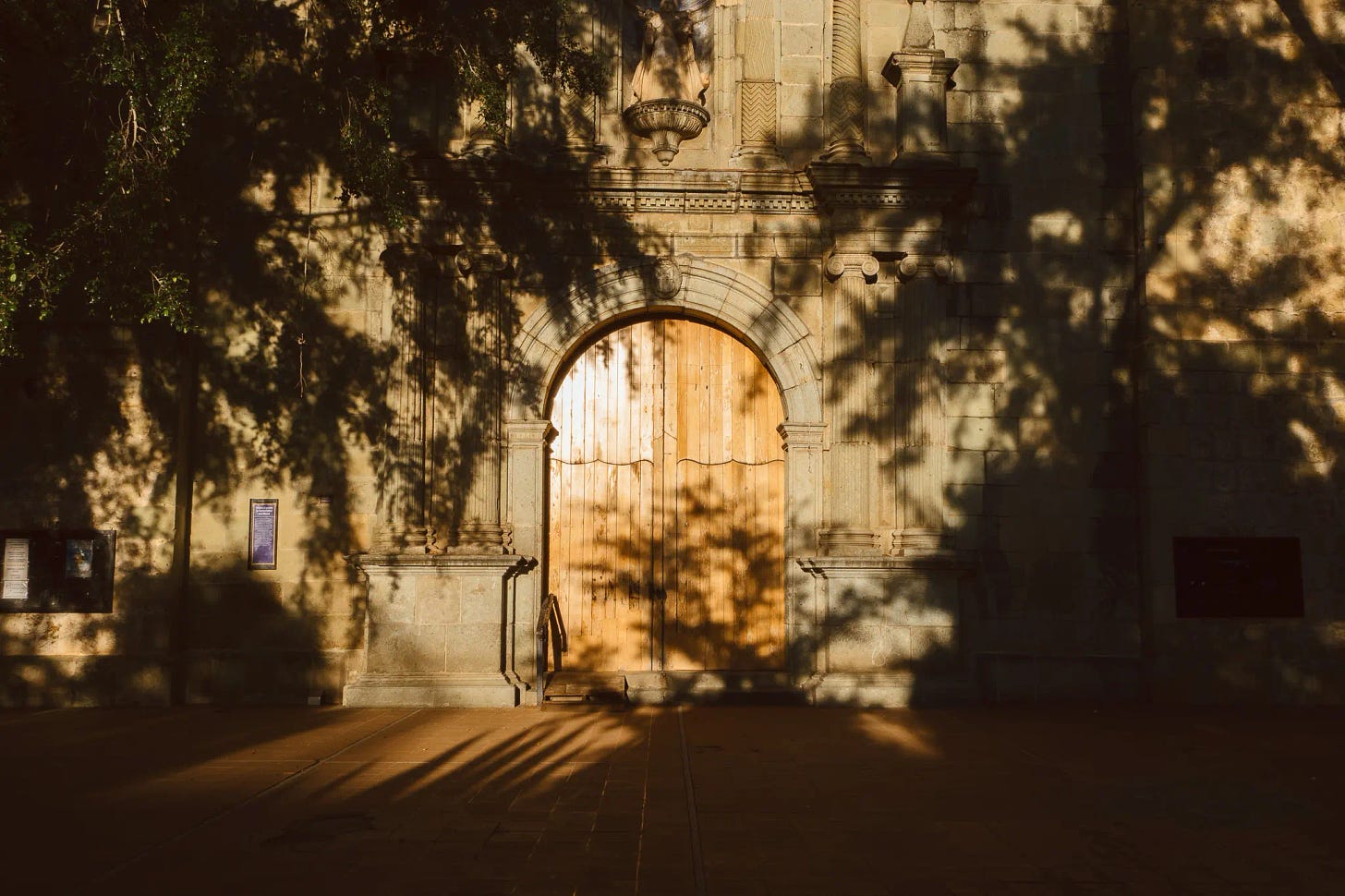 a door to a church at sunset