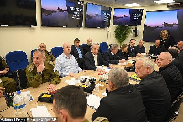 Israel's Prime Minister Benjamin Netanyahu (C) during a War Cabinet meeting at the Kirya in Tel Aviv