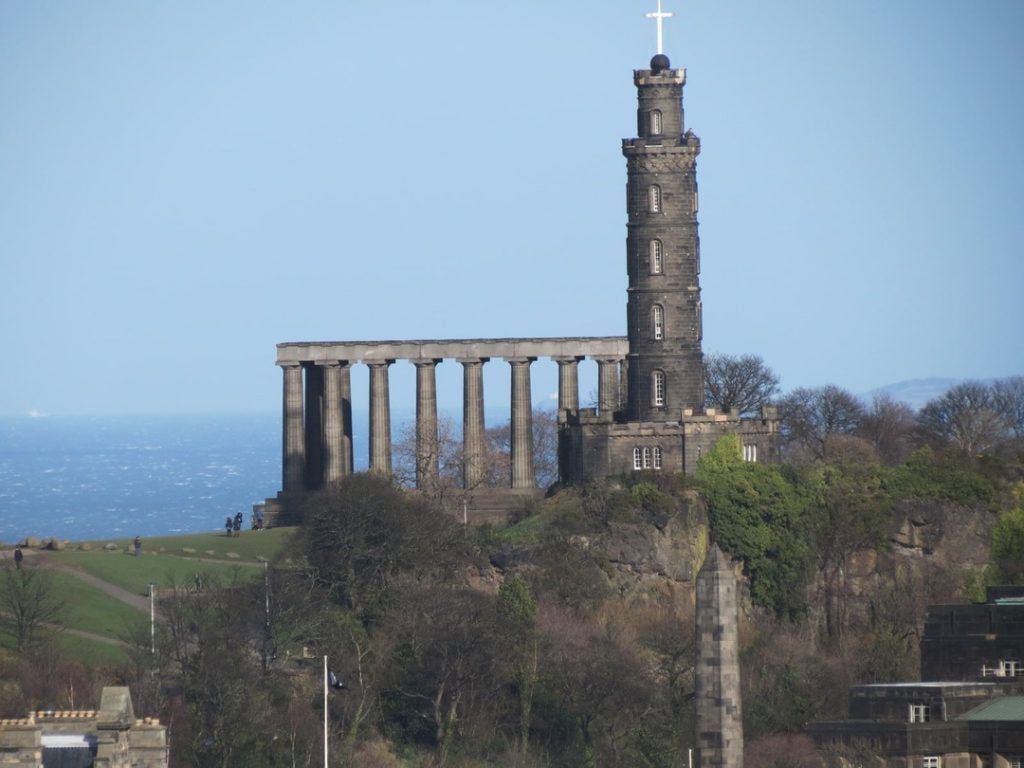 Nelson Monument on hill surrounding Edinburgh