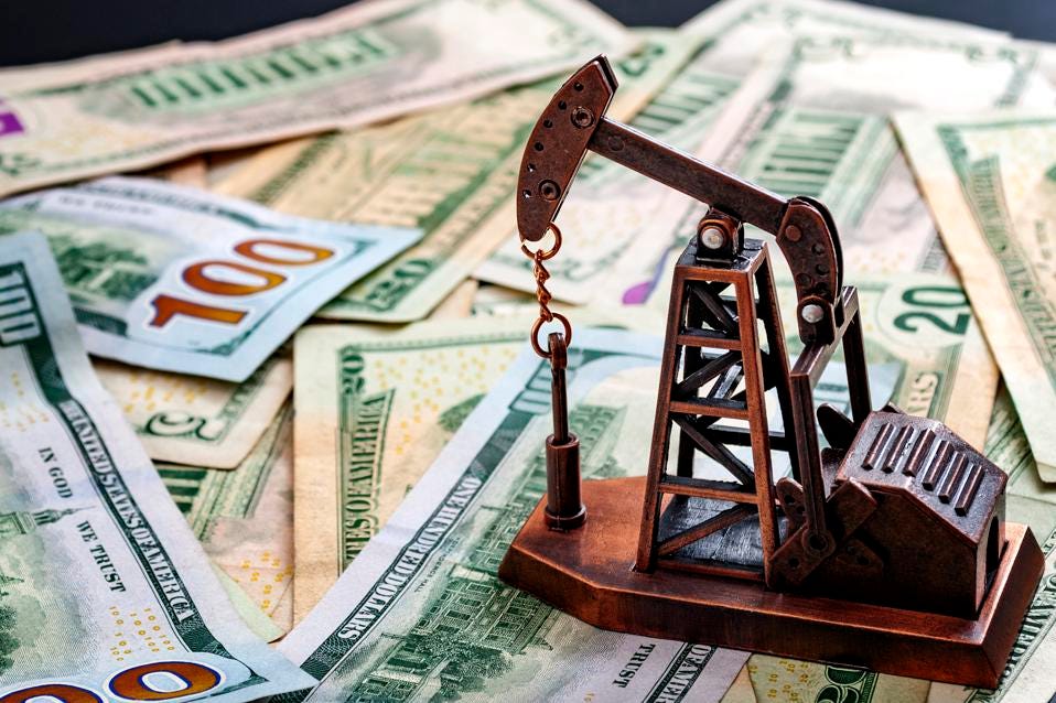 The importance of the petrodollar in the American economy and drilling for oil and profits concept with a oil derrick on top of US dollar bills or notes with copyspace