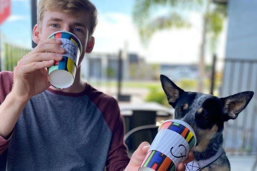 Scout the Australian cattle dog shares coffee with her owner at Foxtail Coffee in Melbourne, Florida