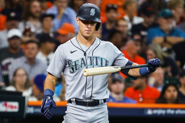 Dylan Moore checks his bat after taking strike two in the second inning as the Seattle Mariners take on the Houston Astros for Game 2 of the American League Division Series at Minute Maid Park in Houston Thursday October 13, 2022. (Jennifer Buchanan / The Seattle Times)