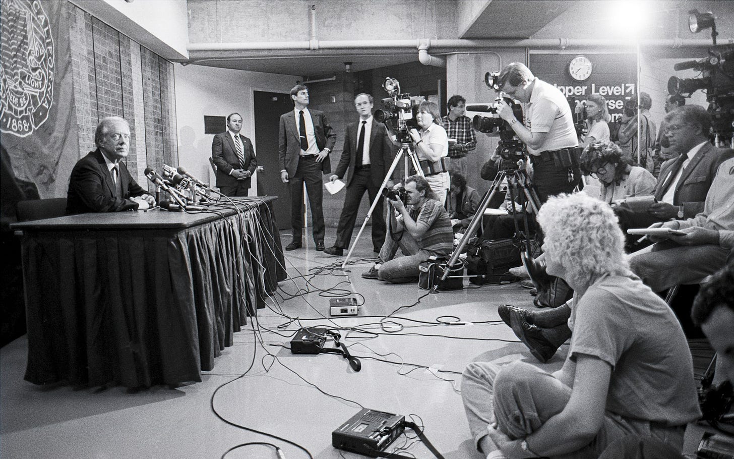 May be a black-and-white image of 9 people and crowd