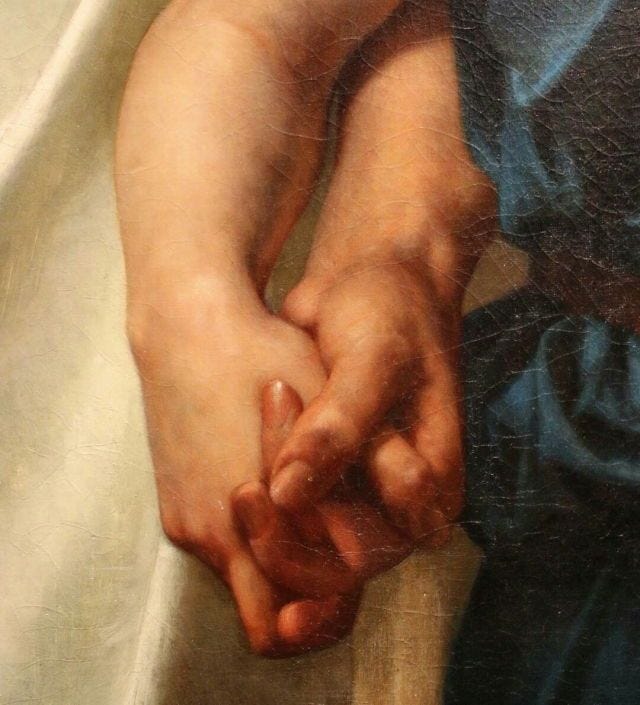 This may contain: two hands holding each other on a white sheet