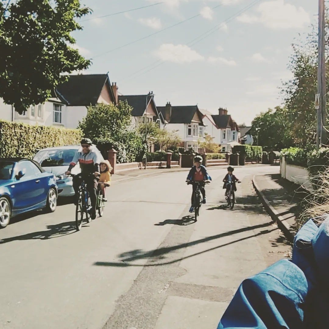 May be an image of 4 people, bicycle, segway, street and road
