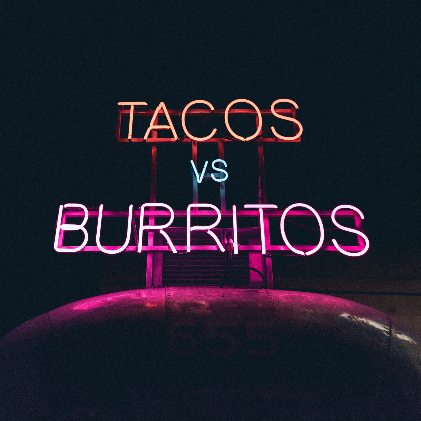 Photo of a neon sign that says "tacos vs. burritos" by Matt Nelson on Unsplash