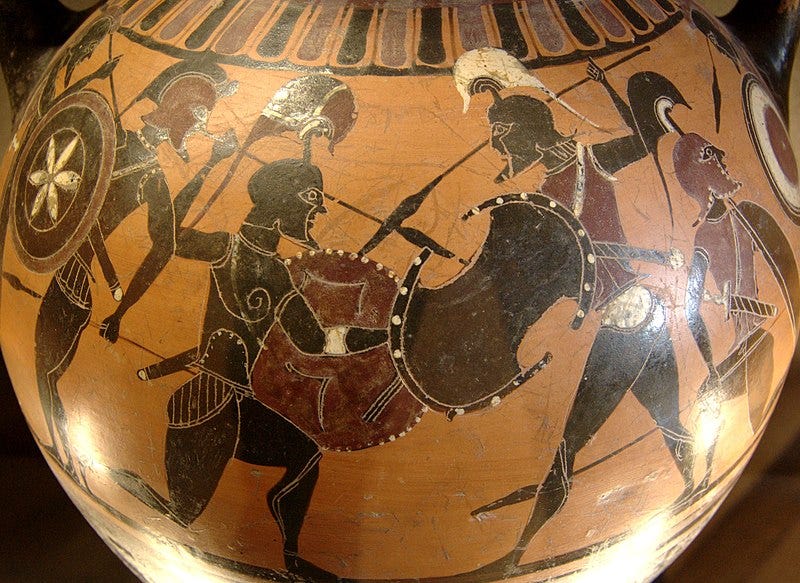 photograph of a black figure vase with warriors armed with shields and spears attacking one another