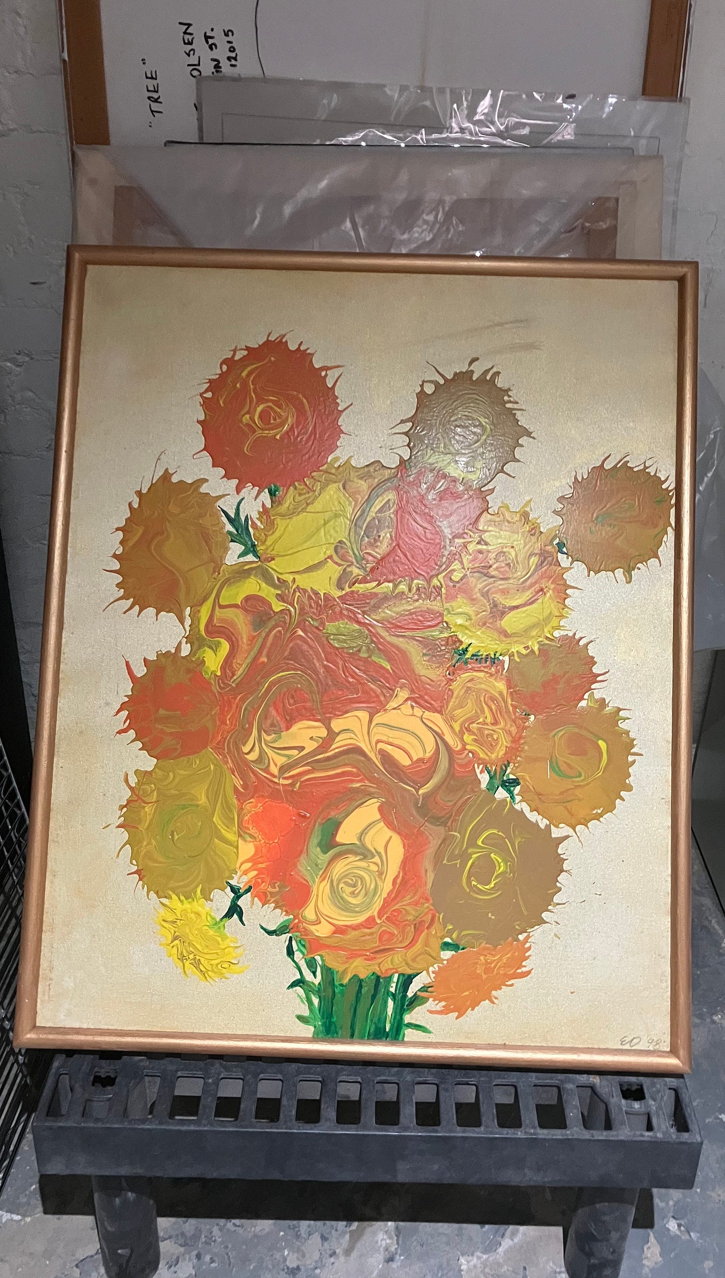 painting of yellow flowers, stored in basement