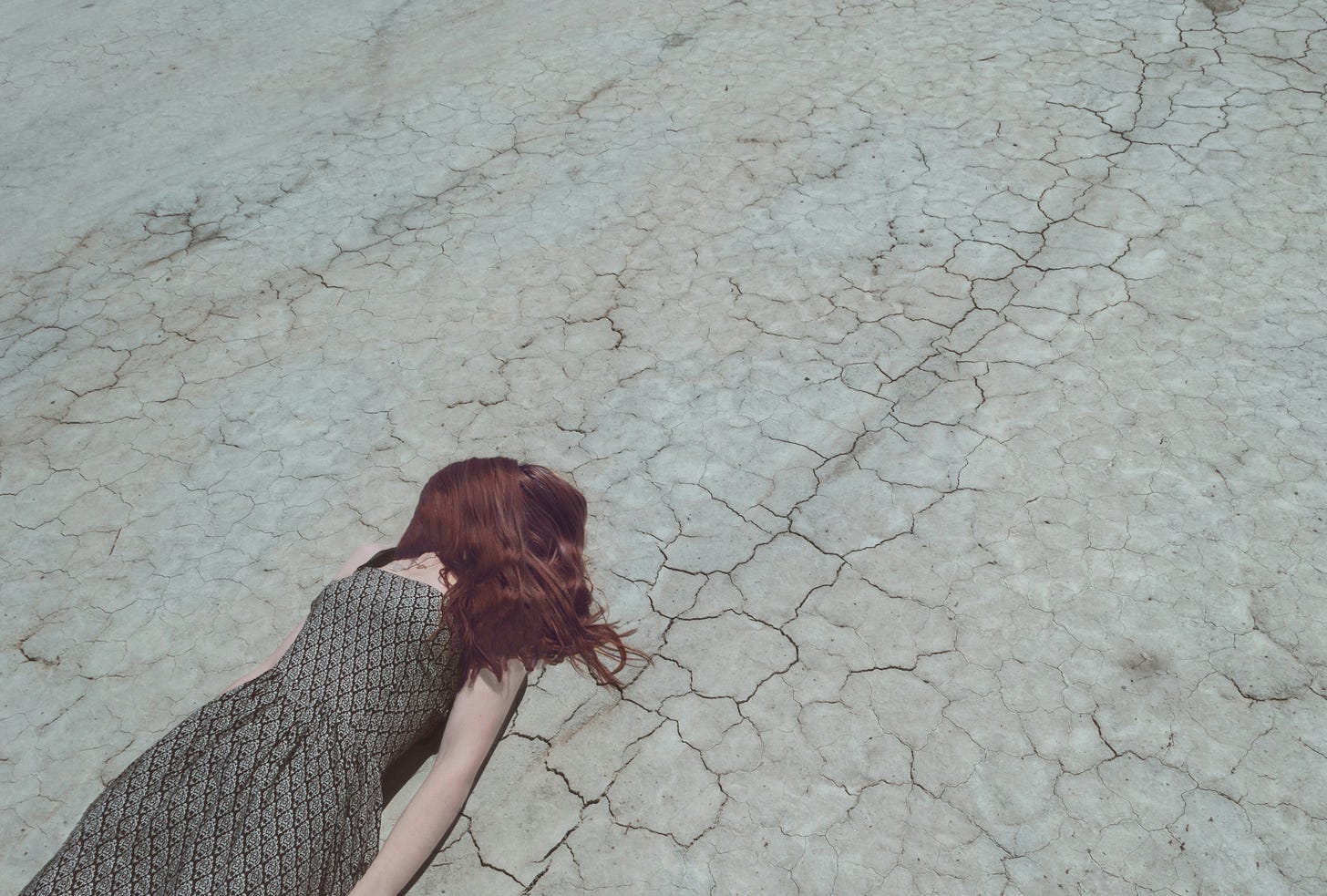 Exhausted Woman Lying On Ground