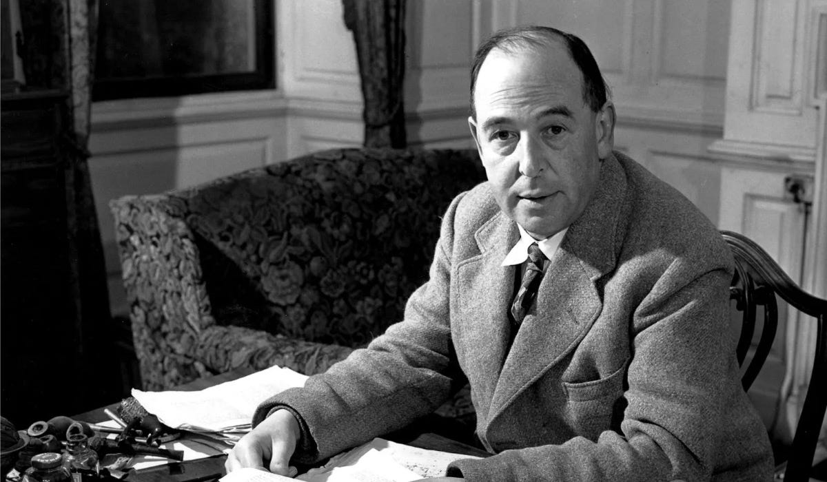 C.S. Lewis at a desk with papers