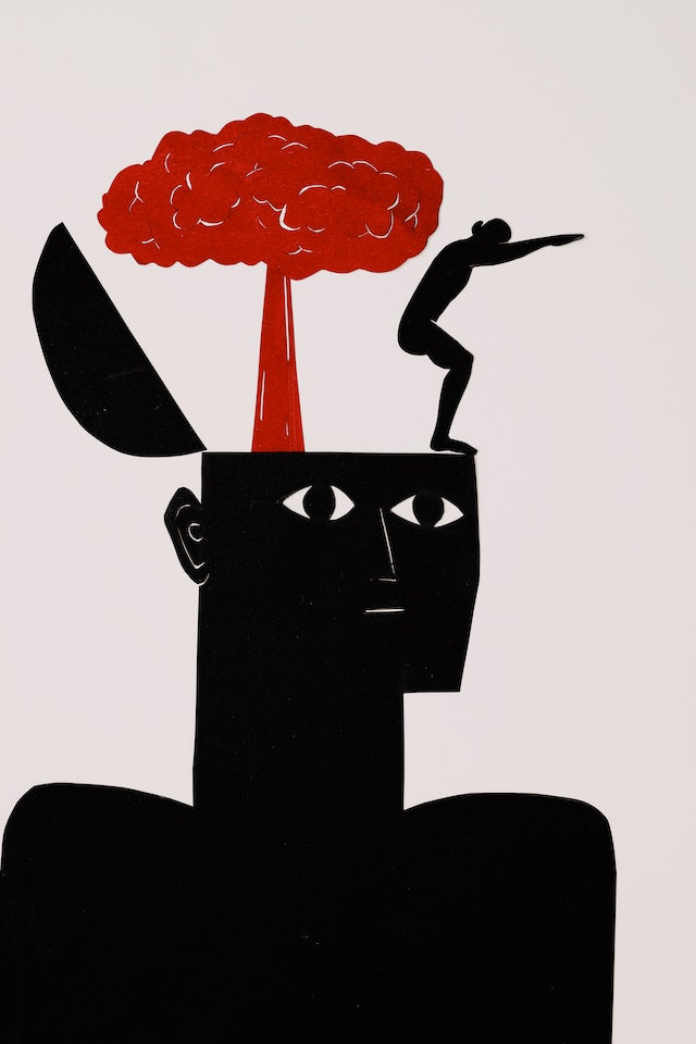 A black silhouette with the top of the head open, a nuclear explosion coming from within, and a person about to dive overboard