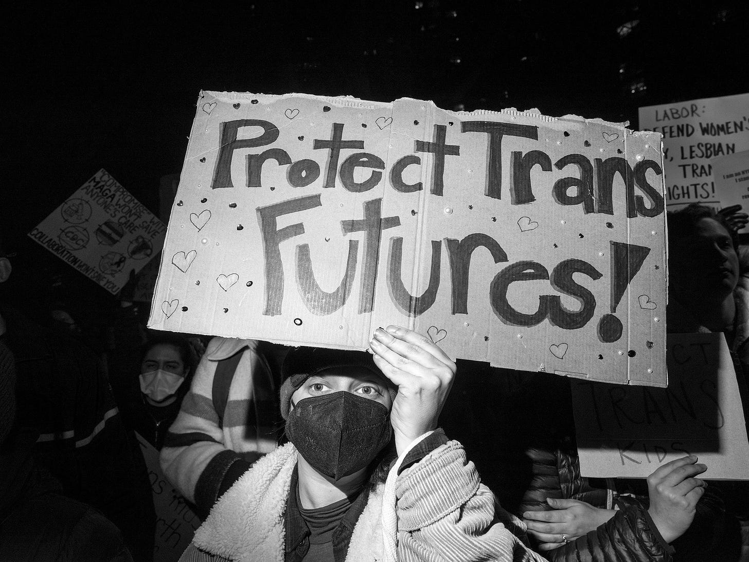 A person holding a protest sign.