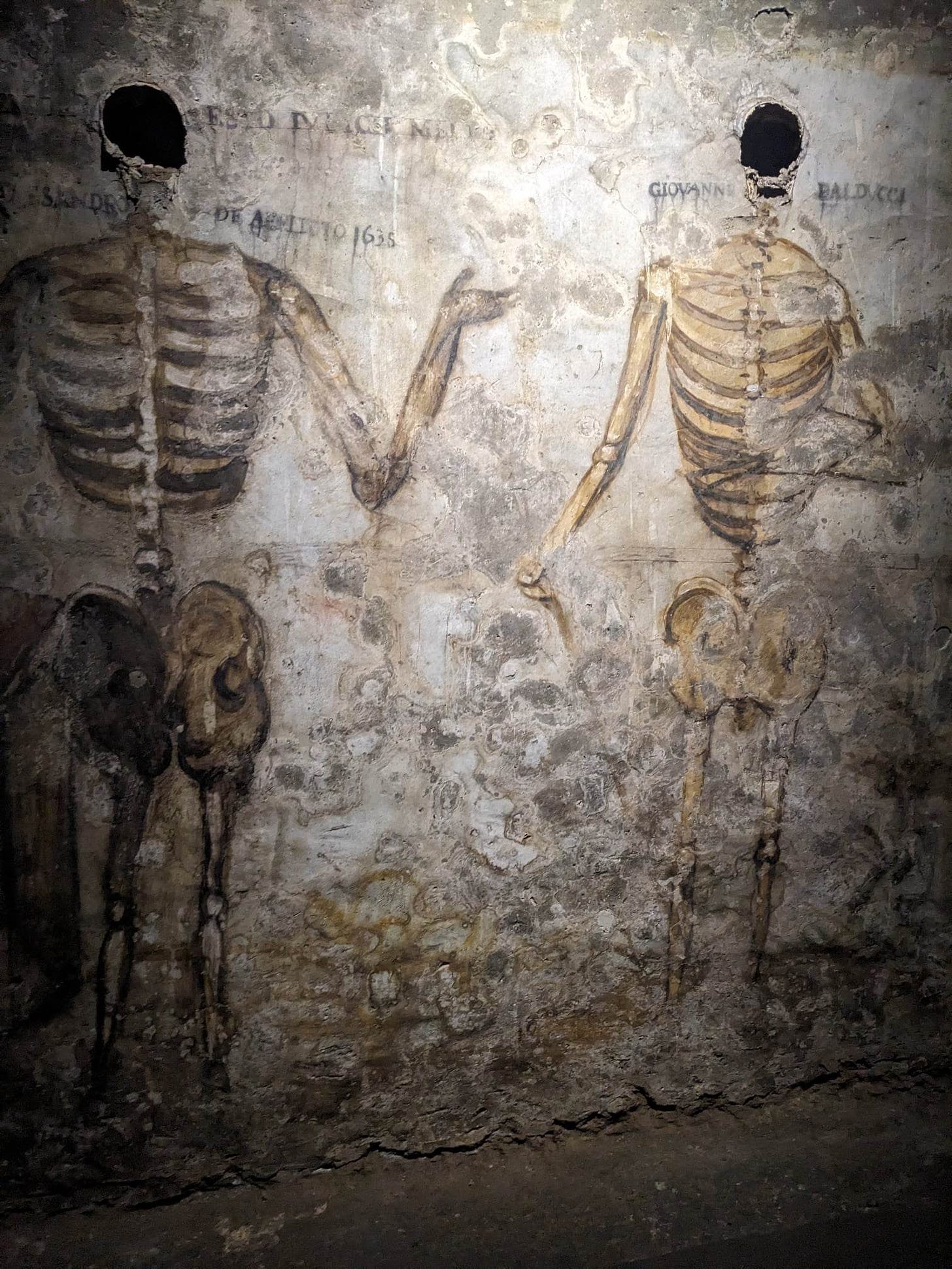 Fresco of two skeletons.