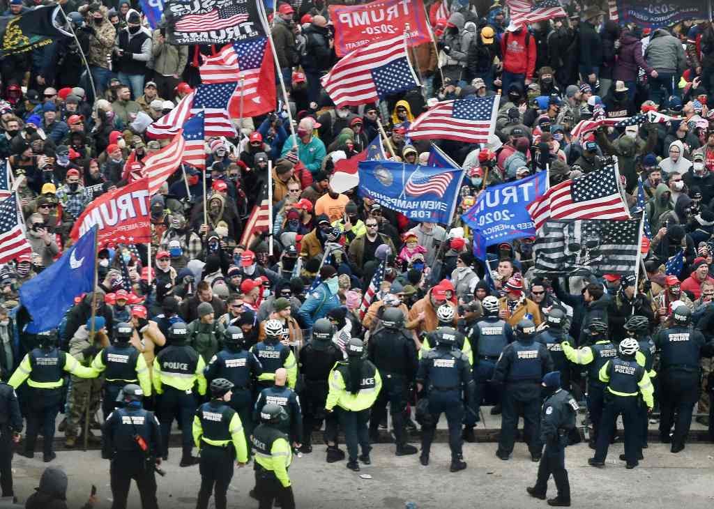 Trump supporters clash with police and security forces as they storm the US Capitol in Washington, DC, on Jan. 6, 2021.