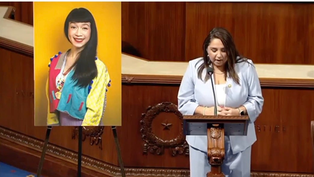 Delia Ramirex next to poster of Nat, talking about how great she is in the House chambers