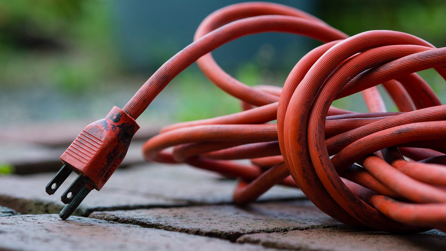 close up photo of orange extension cord.