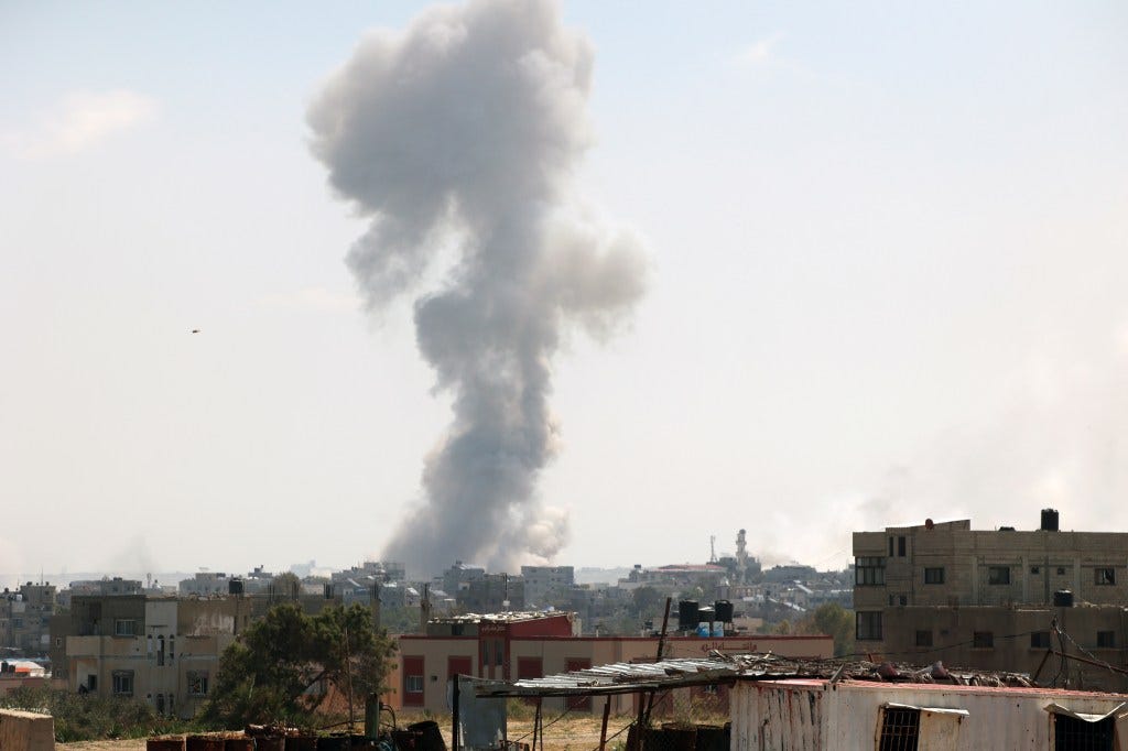 Smoke rises during an Israeli military operation in Al Nusairat refugee camp south of Gaza.