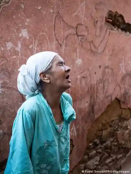 A woman crying in front of her earthquake-damaged house in the old city in Marrakesh 