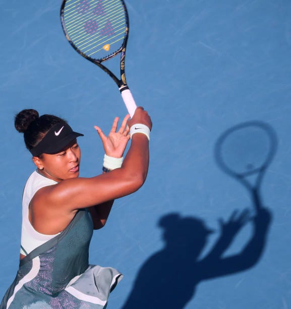 Naomi Osaka of Japan plays against Caroline Garcia of France in the third round of the women's singles at the 2024 Miami Open at Hard Rock Stadium in...