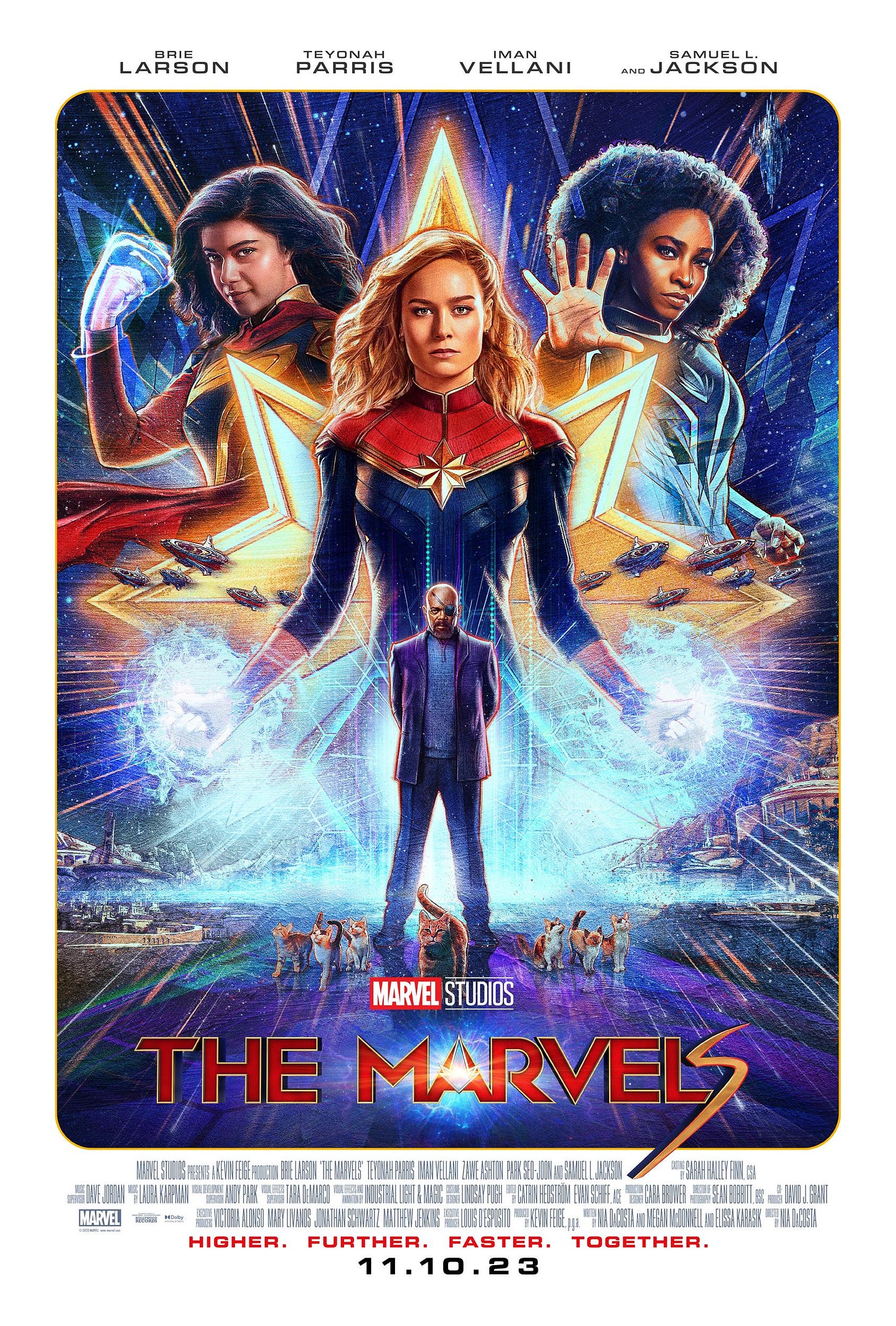 Brie Larson in the middle, arms out and charged with golden energy, Teyonah Parris to the right semi transparent, Iman Vellani to the left making a fist, Samuel L. Jackson beneath them all surrounded by cats