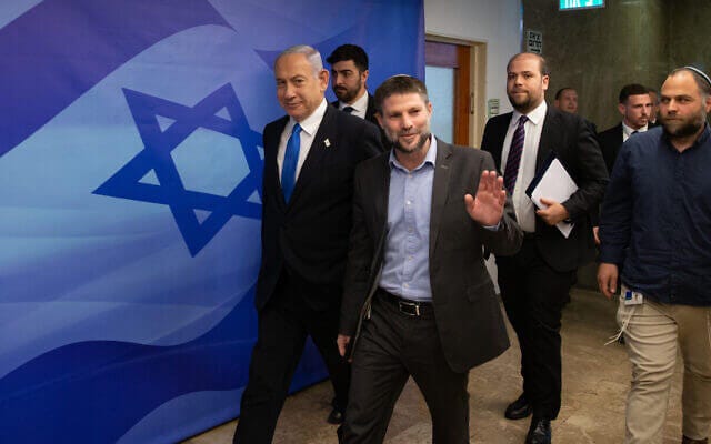 Israeli Prime Minister Benjamin Netanyahu and Minister of Finance Bezalel Smotrich arrive to a cabinet meeting on the state budget, at the Prime Minister's Office in Jerusalem on February 23, 2023. (Photo: Alex Kolomoisky/POOL)