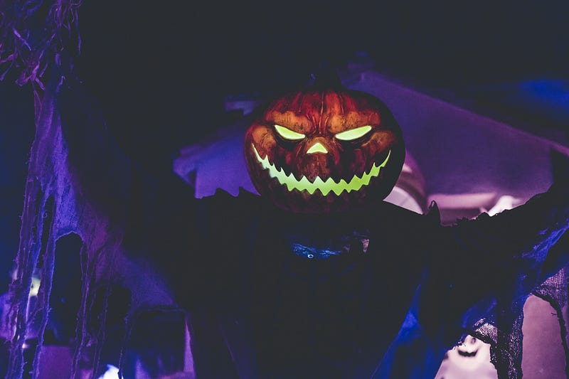 Dressed in a Pumpkin like a Jack O’ Lantern.