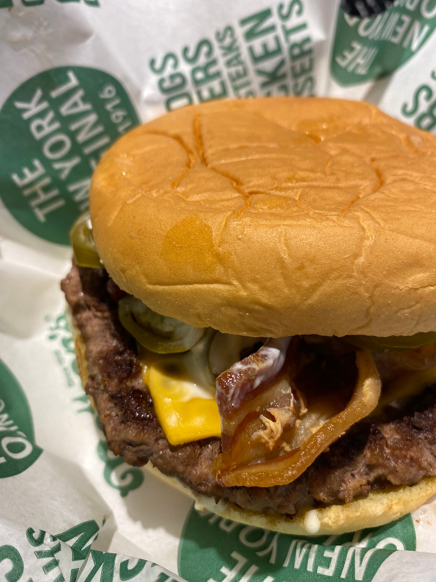 A Nathan’s Famous ‘Hell’s Kitchen Burger’ (a cheeseburger with bacon, jalapeños and ranch sauce).