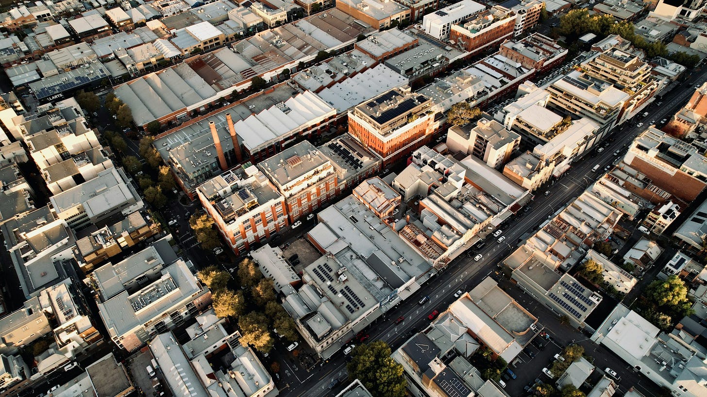 The white and grey roofs of the converted industrial buildings in Collingwood in the city's inner north.
